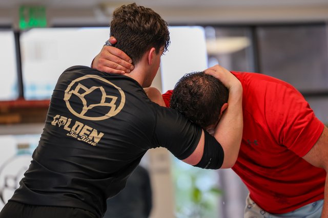 Two members drilling standup grappling at Golden Jiu Jitsu