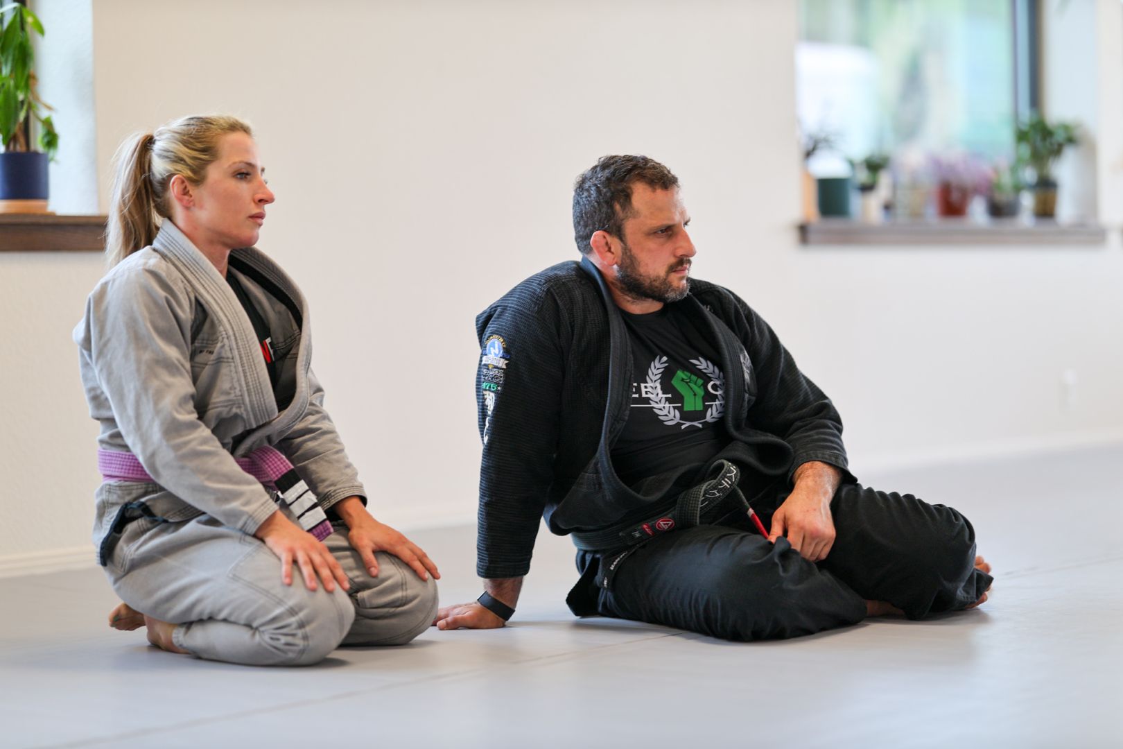 Members listening to instruction during class at Golden Jiu Jitsu