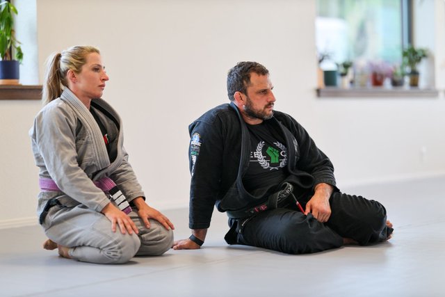 Members listening to instruction during class at Golden Jiu Jitsu
