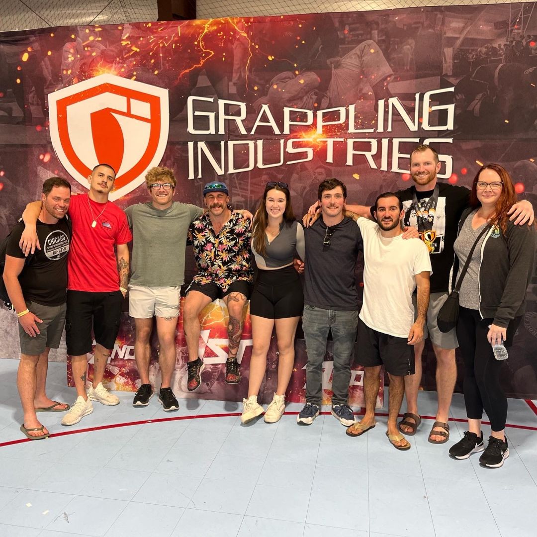 GJJ members posing arm in arm at a local grappling competition