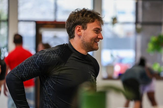Member smiling between rounds at Golden Jiu Jitsu